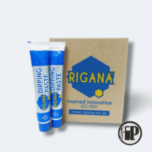dipping-paste-petromechzw20250721_120457 Two blue and white tubes of Rigana Dipping Paste are displayed in front of a brown box labeled "Rigana Dipping Paste 12 X 60g Case," featuring the Rigana logo, website, and the phrase "Inspired Innovation ISO 9001.