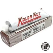 A tube of Kolor Kut Modified Water Finding Paste (for Ethanol and Gasoline Blends) rests on its box, which displays the manufacturer's information: Kolor Kut Products Co., Houston, Texas. The silver tube has red and brown lettering.